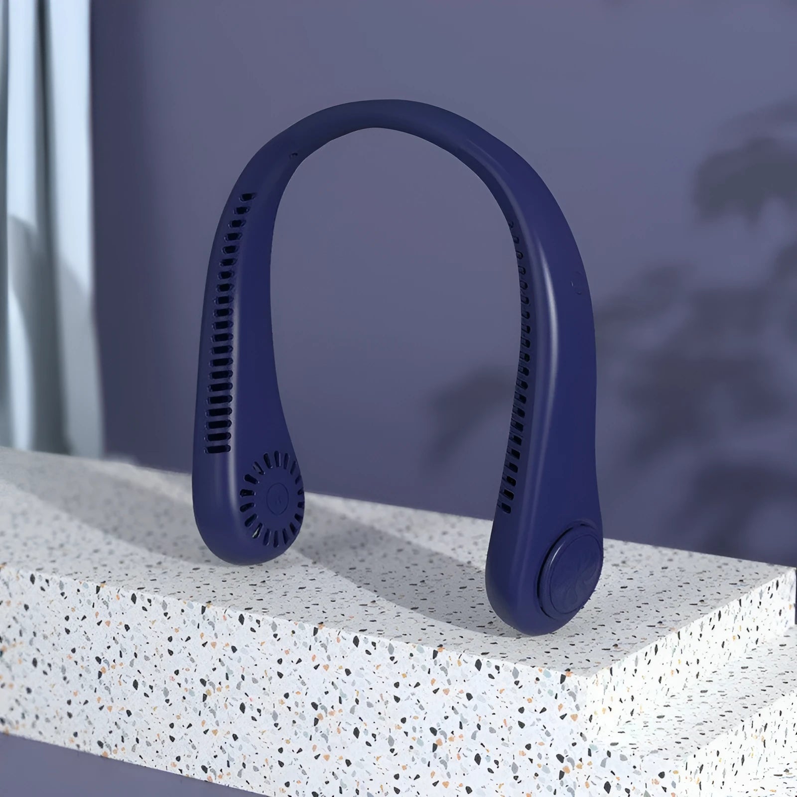 Blue bladeless neck fan being worn, showing the flexible neckband and the safe air outlet.