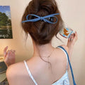 Handmade plastic hairpin with fabric and acrylic decorative elements and triangular grip