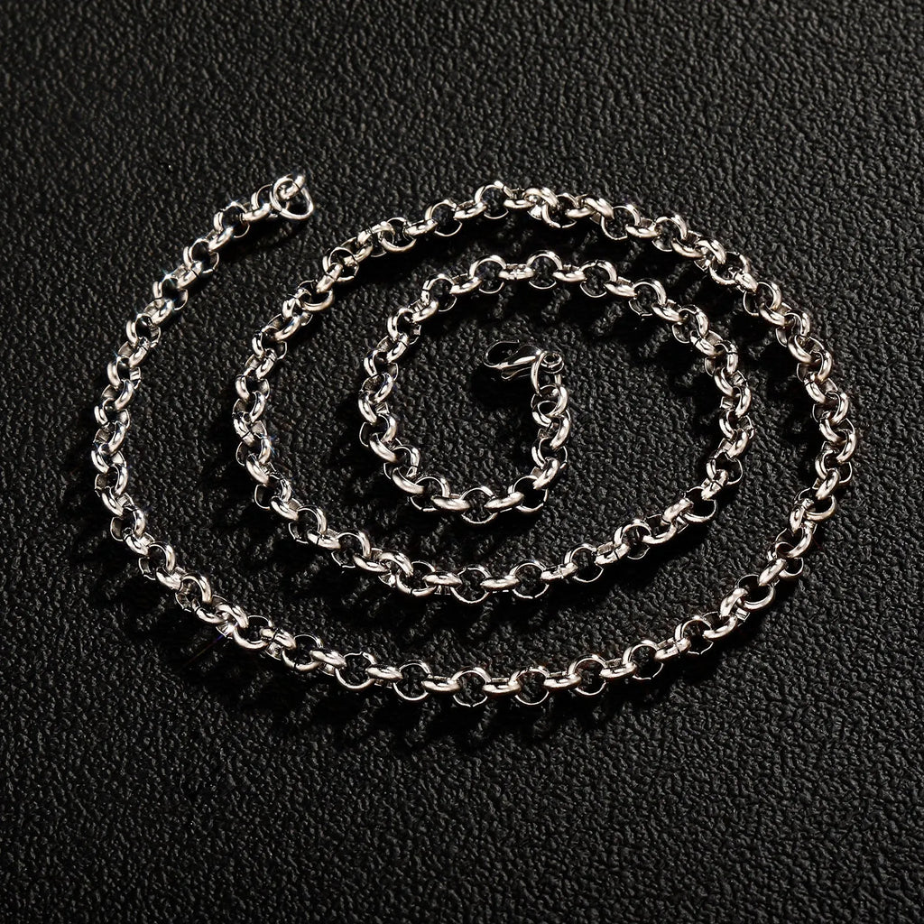 Silver stainless steel men's punk ring buckle necklace with O-ring chain and copper zircon pendant on display