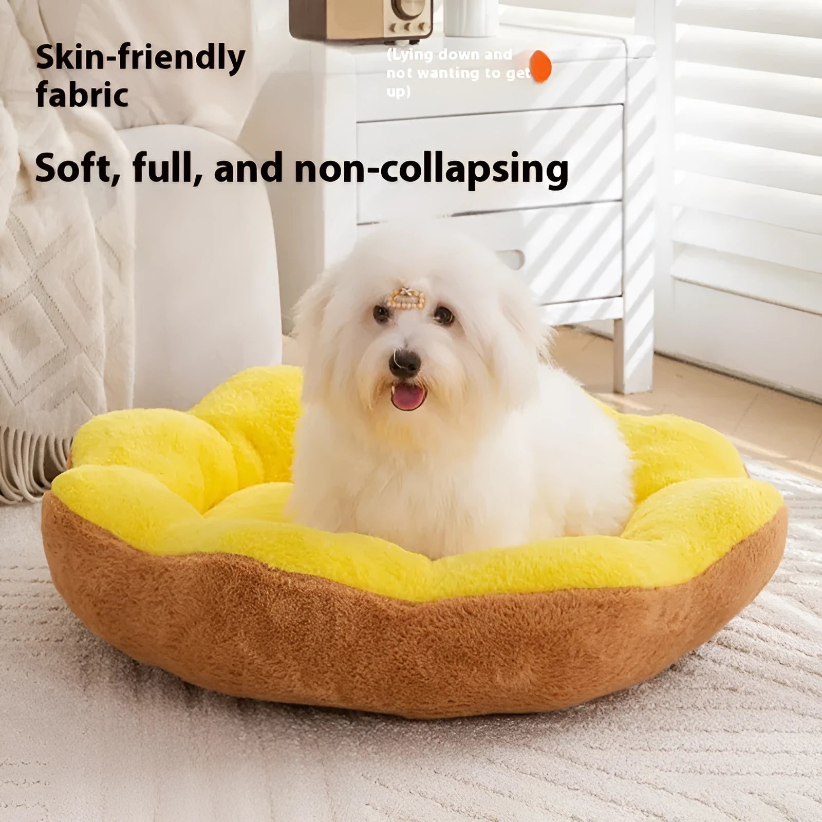 Round grey and black plush cat bed with a raised rim and a removable inner nest, shown on a wooden floor.