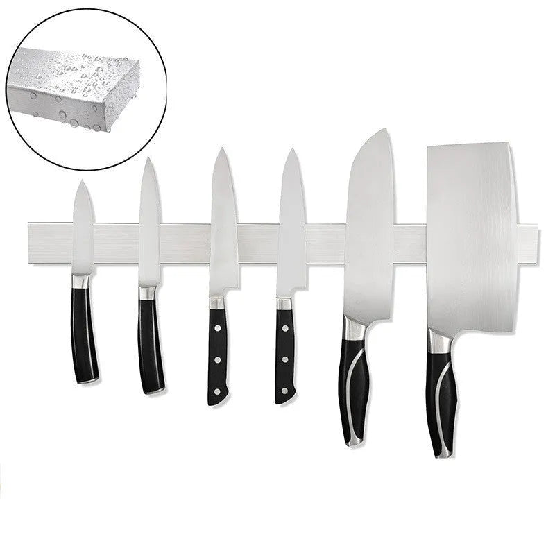 Stainless steel wall-mounted kitchen knife storage rack on a tiled wall