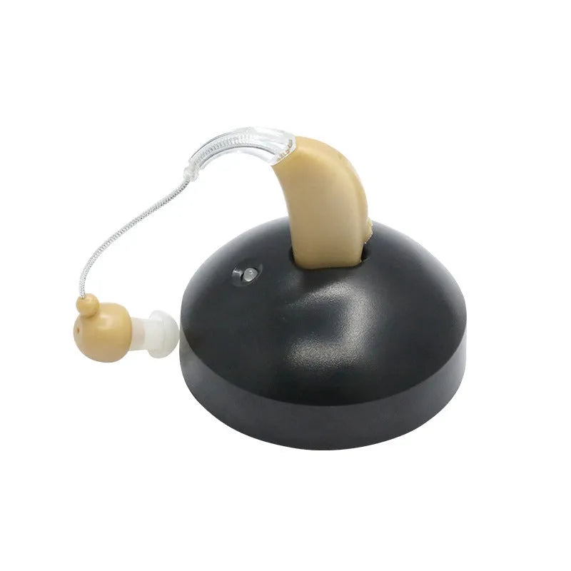 Black rechargeable hearing aid amplifier with silicone ear tips for elderly users