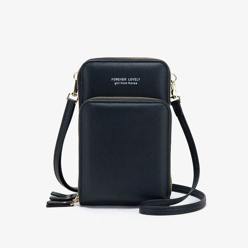 Green crossbody bag with tri-fold pockets and zipper closure on white background