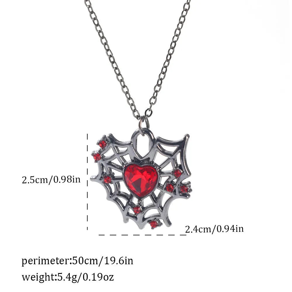 Halloween necklace with spider, bat, cross, and heart charm pendants on a metal chain.