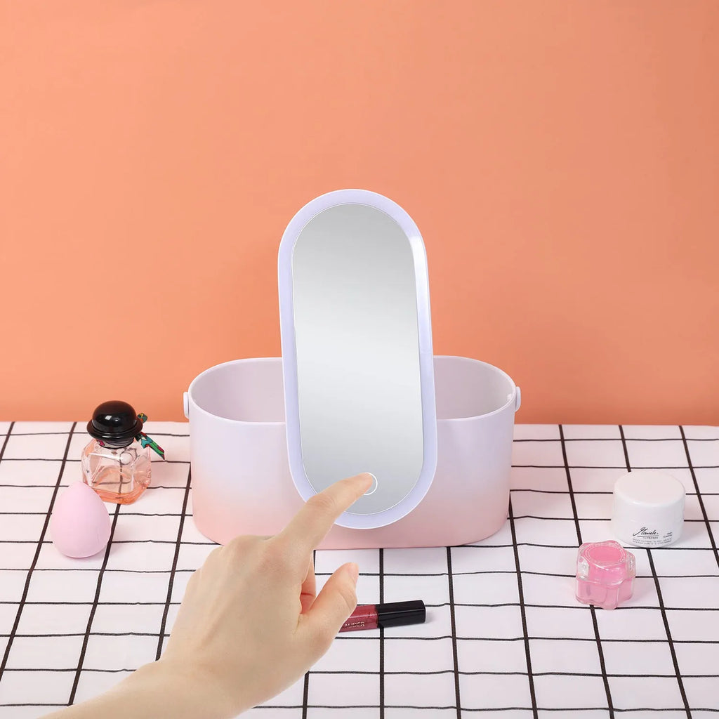 Portable pink LED makeup mirror storage box with cosmetic compartments open