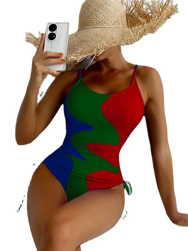 Women's sleeveless backless one-piece swimsuit in blue, purple, brown, or green.