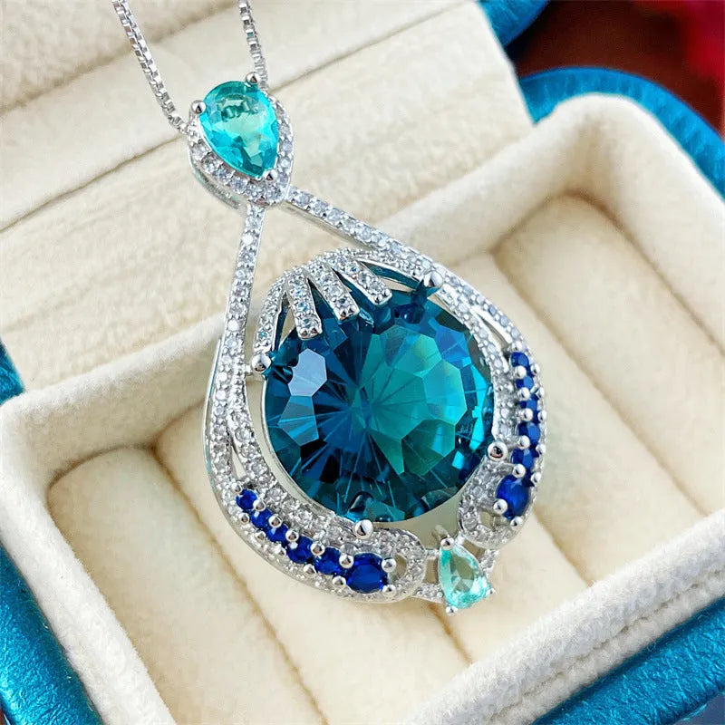 Blue geometric pendant necklace with fireworks cut crystal gemstone and water wave chain