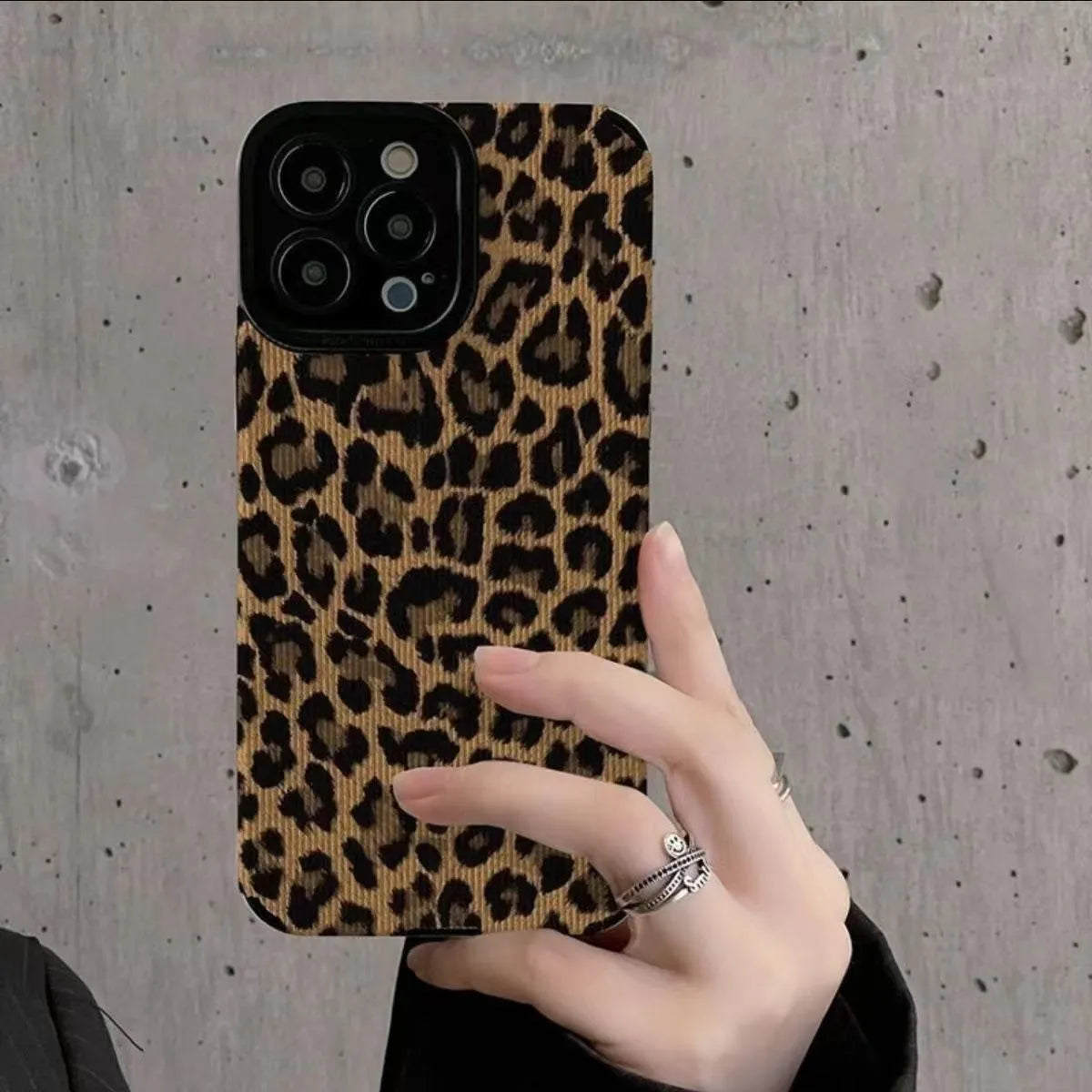Brown leopard print iPhone 15 phone case with three-dimensional relief and TPU material.