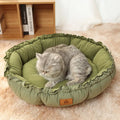 Grey reversible donut-shaped pet bed with a raised rim for a cat or small dog.