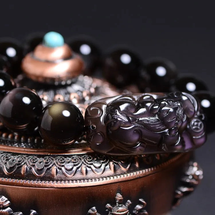 Unisex polished crystal Pi Xiu bracelet in ethnic geometric design with ice stone beads.