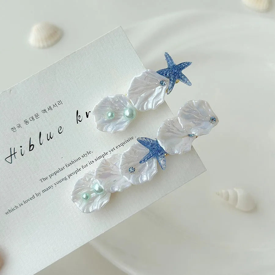Starfish shell side bang clip barrette in short or long style with shell fishtail design