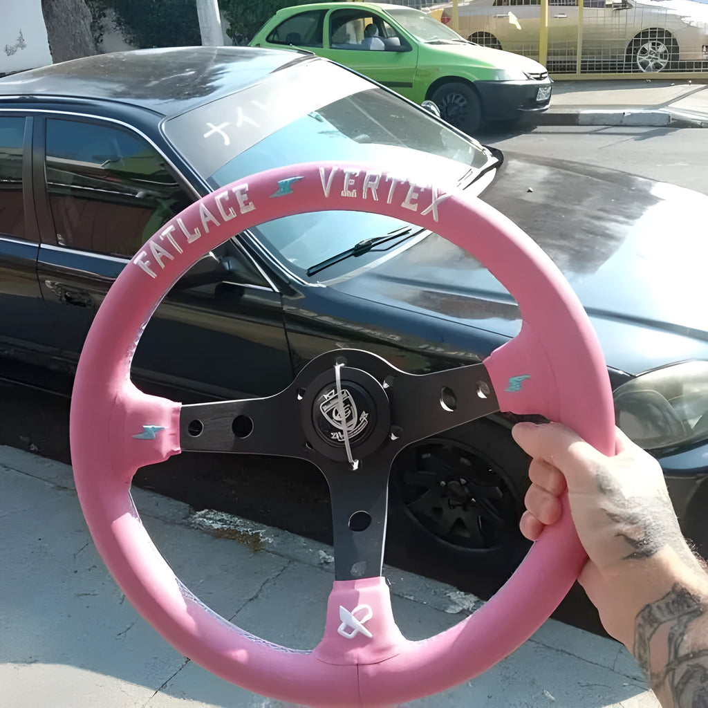 Pink leather steering wheel cover with embroidery detail and aluminium bracket