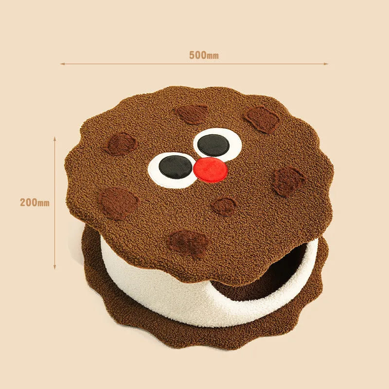 Khaki-coloured enclosed cat nest bed shaped like a sandwich cookie with a high entry wall.