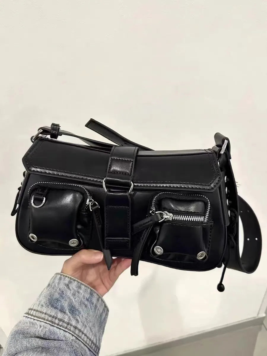 Black medium-hard PU women's baguette messenger bag with adjustable strap and zippered internal change compartment.