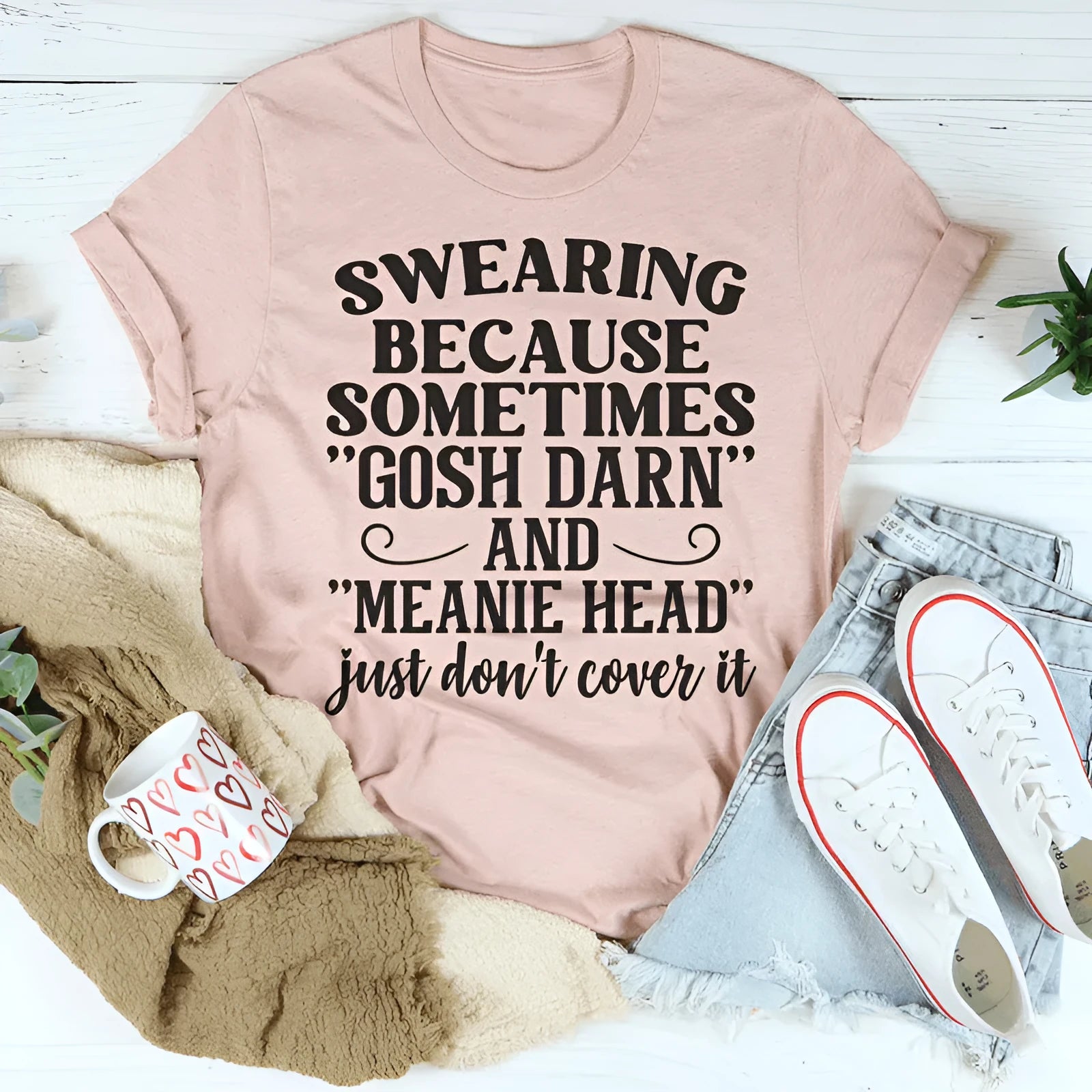 A pink solid colour T-shirt for couples with a printed design, shown in a straight-cut, short-sleeve style.