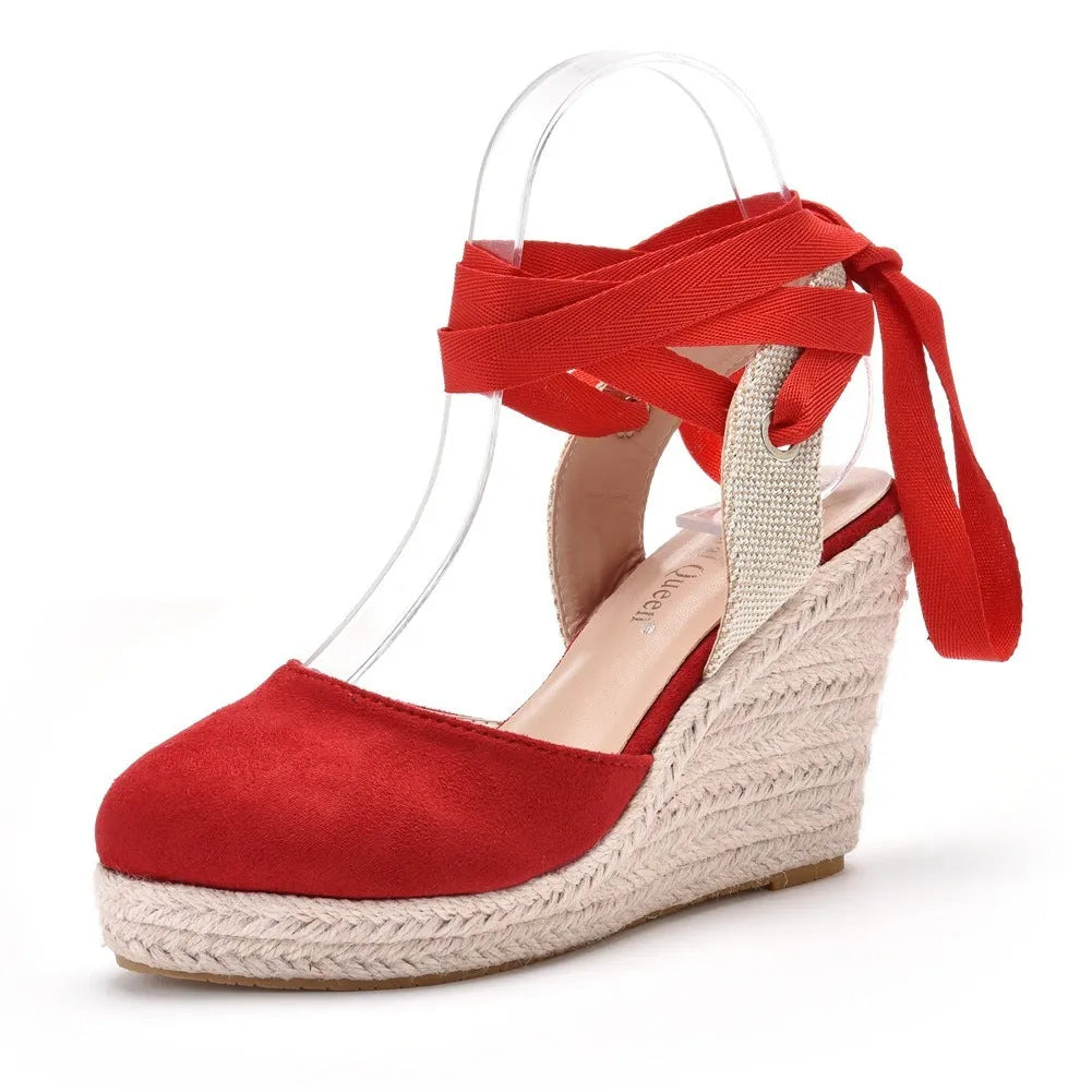 Women's apricot wedge platform sandals with bead details and a buckle strap on a white background.