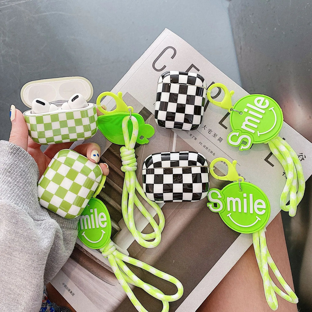 Black and green checkerboard pattern TPU protective sleeve for AirPods case with optional lanyard.