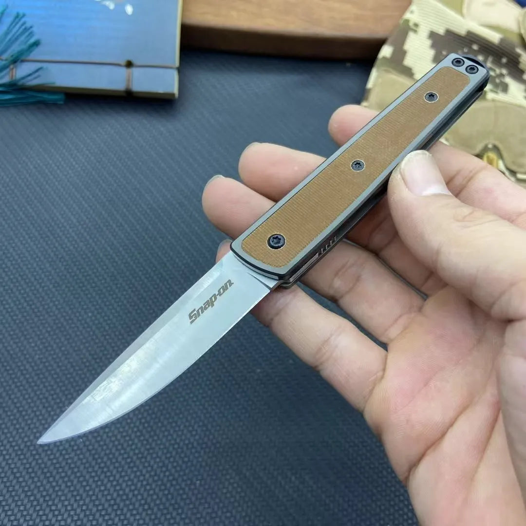 Folding fruit knife with stainless steel blade in black, coffee, or red colour options showing extended and closed positions