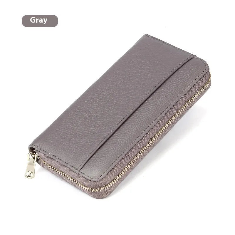 Long genuine leather women's wallet in solid colour with anti-theft card swiping feature