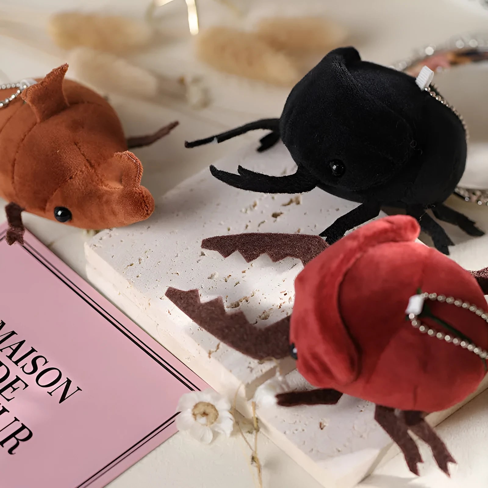 Small black Japanese rhinoceros beetle plush doll pendant with soft short plush fabric.