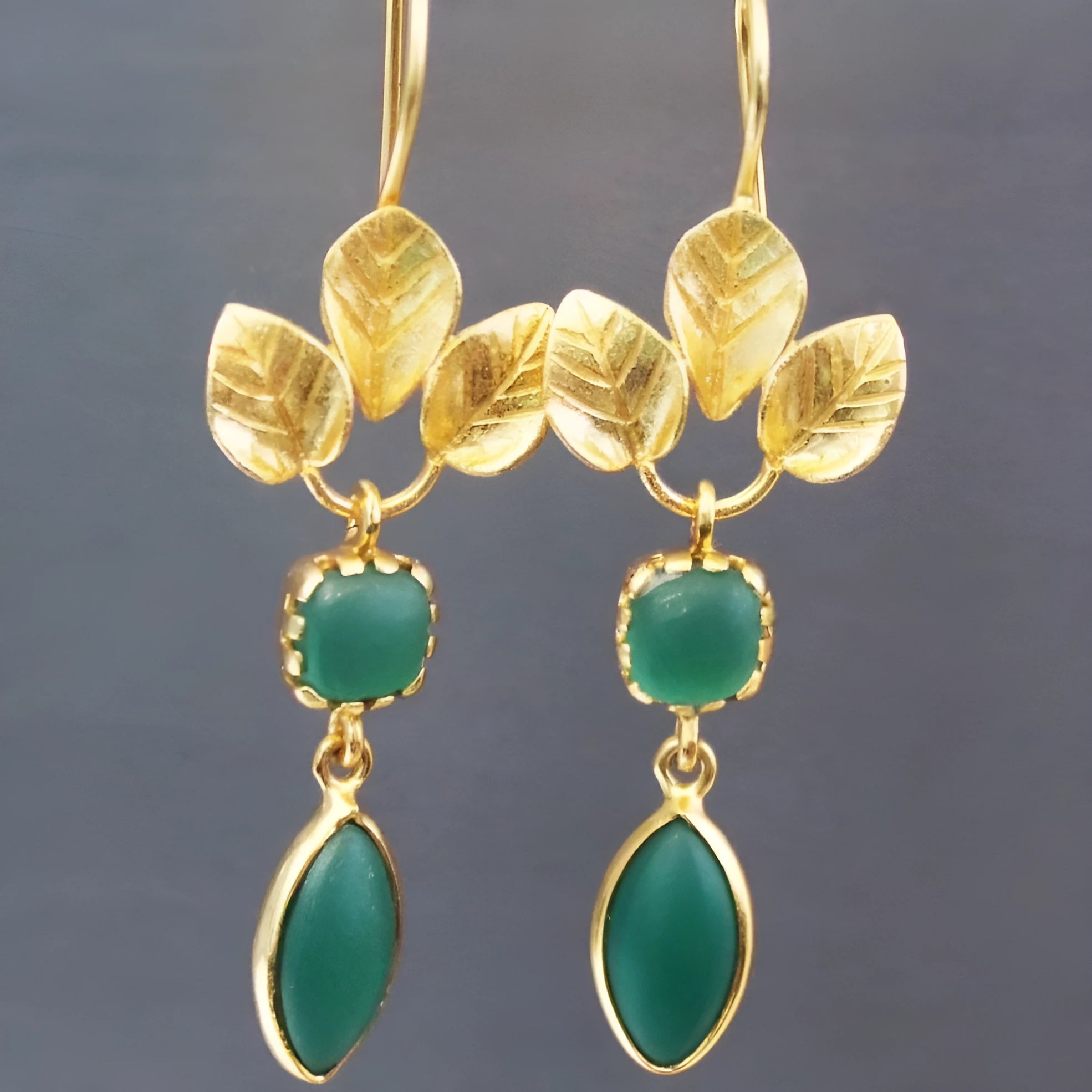Gold copper earrings with water drop shape, French leaves tassel, and zircon detail.