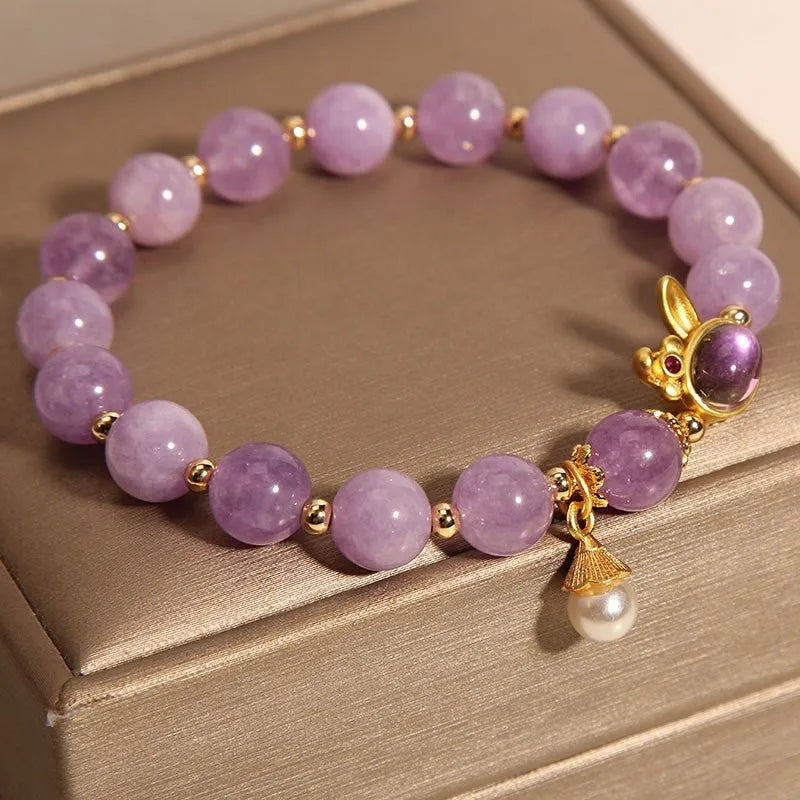 Mauve jade hare head pendant on a clear crystal bracelet, Mori style design.