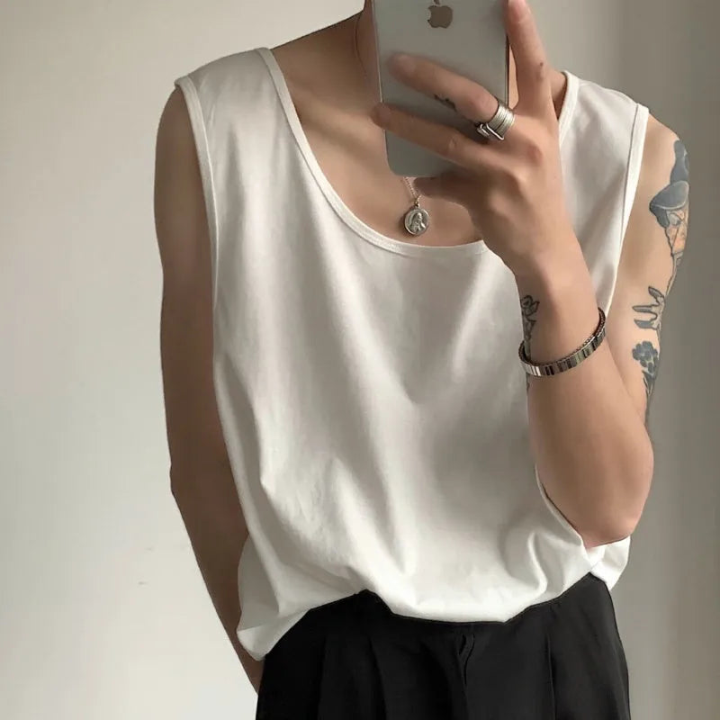 Sleeveless vest in solid colour, loose fit, polyester blend, straight hem, available in black and white for summer casual wear