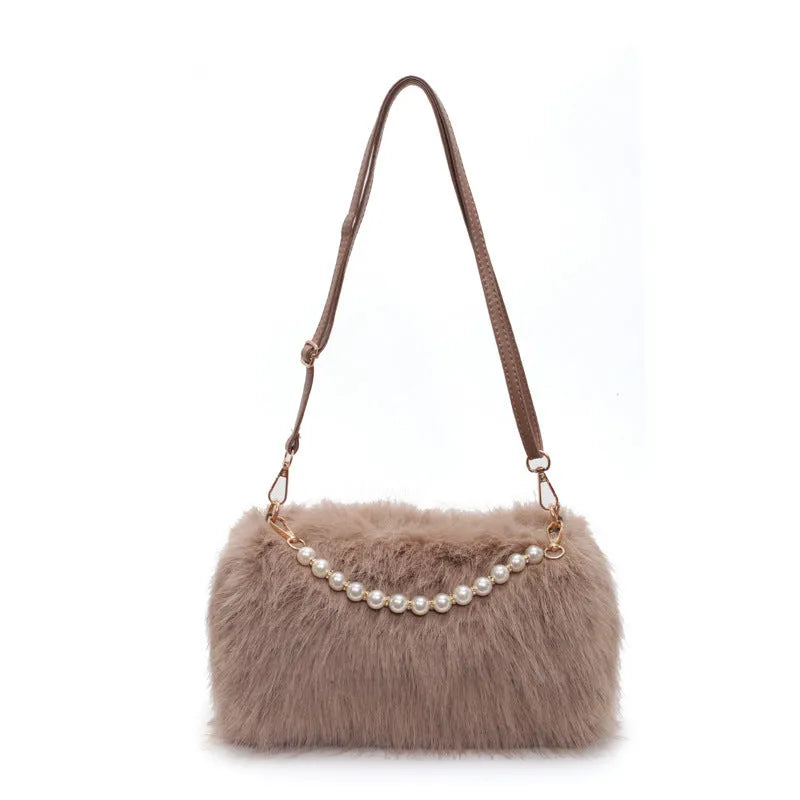 Plush shoulder bag with pearl chain, 27cm wide, shown in black for autumn winter commuting