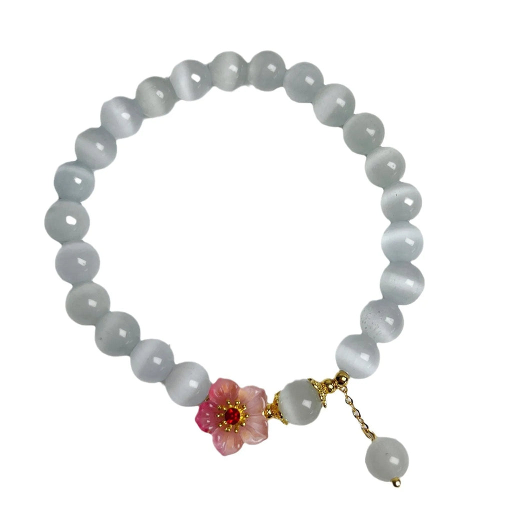 White opal flower beaded bracelet made from glass and coloured glaze in a Chinese fashion style.