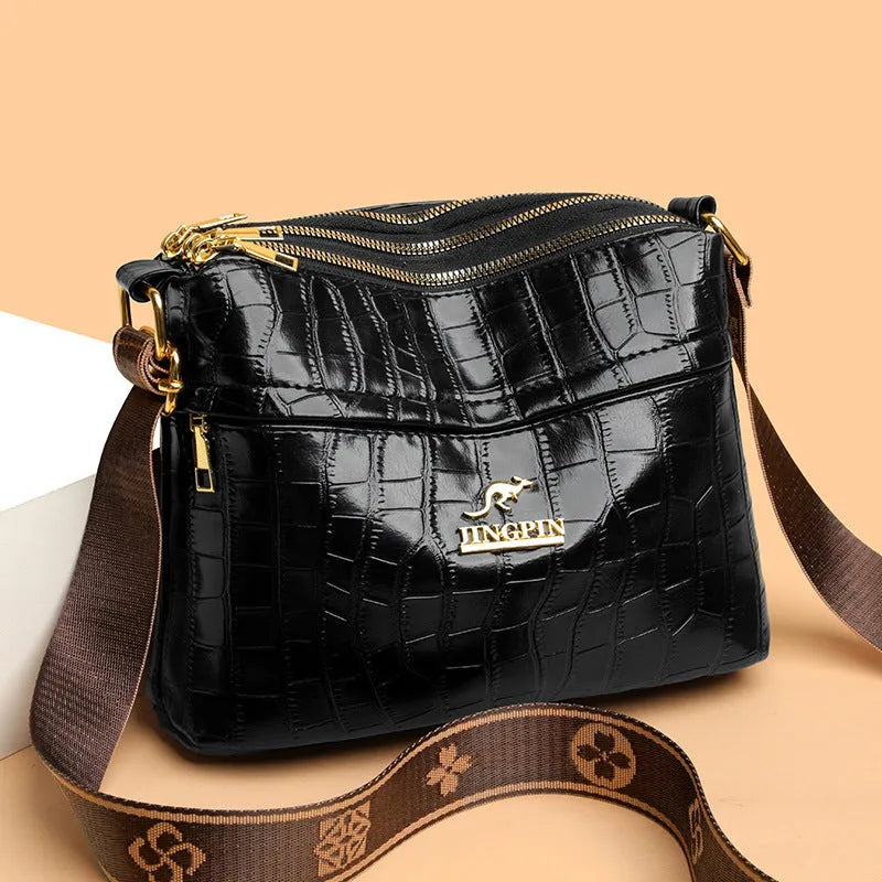 Cross body messenger bag in horizontal square shape with multiple compartments and sandwich pocket construction