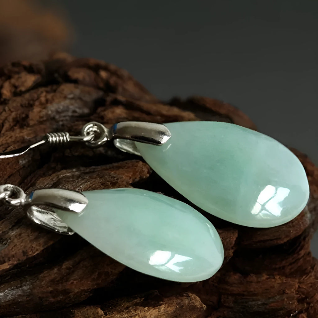 Natural Hetian water drop jade earrings on display showing gray jade colour with alloy ear wire