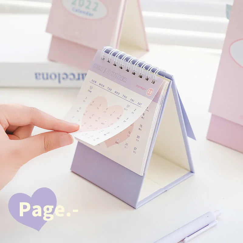 Cream coil bound desk calendar with paper pages, 100mm x 100mm for small desk use