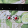 Handmade Miao silver ethnic earrings with turquoise on a retro flower disk design.