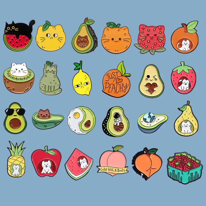 Colourful cartoon fruit design metal brooch with pin clasp on a denim jacket.