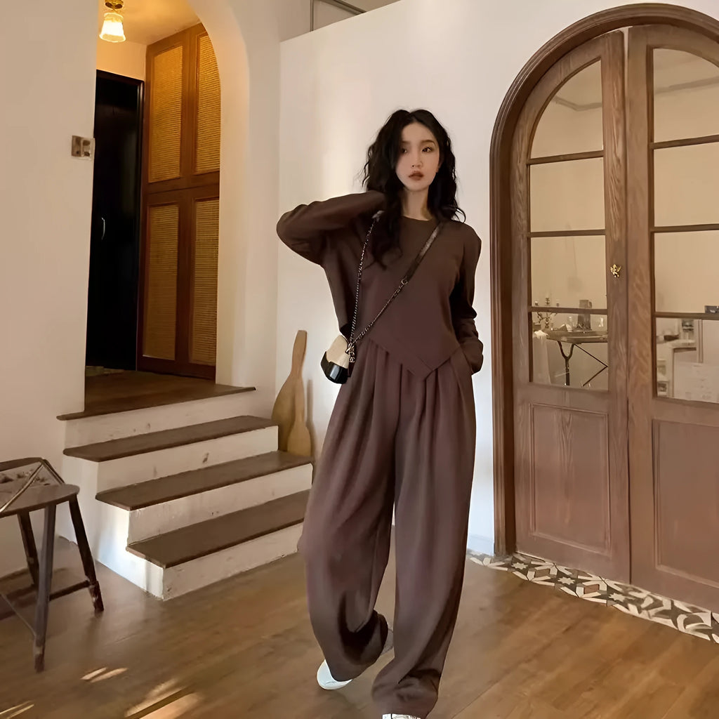 Women's khaki loose-fit polyester sports suit with long sleeves and full-length trousers.