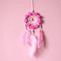 Pink ostrich feather dreamcatcher wall decoration ornament measuring 10cm.