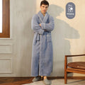 Man and woman wearing matching thick navy blue flannel bathrobes, showcasing the couple's winter loungewear.