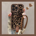 Brown leopard print silicone lanyard case for iPhone with hands-free strap.