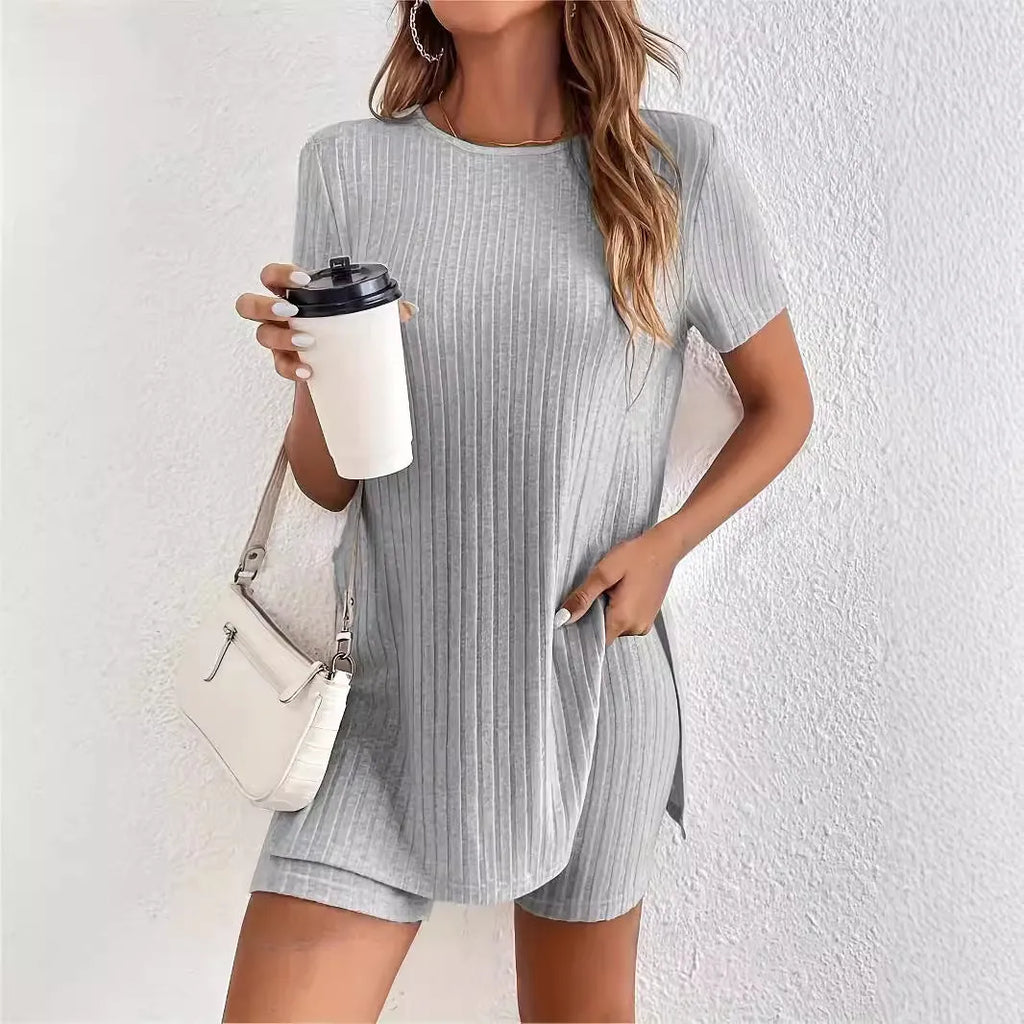 Women's grey ribbed cotton two-piece pyjama set with crew neck top and shorts on a hanger.