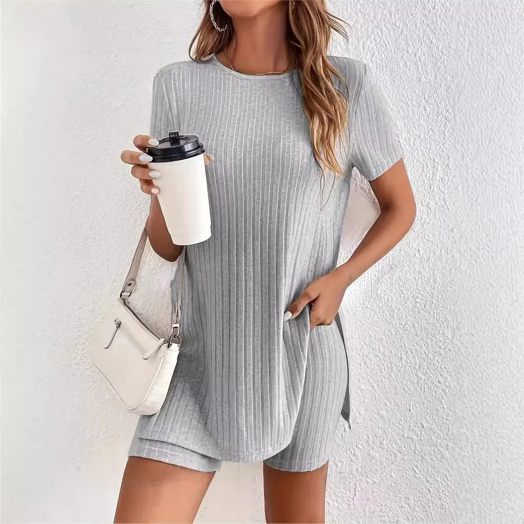 Women's grey ribbed cotton two-piece pyjama set with crew neck top and shorts on a hanger.