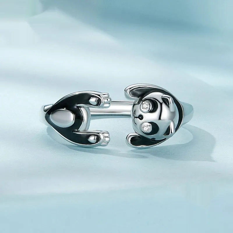 Adjustable sterling silver panda open ring bracelet with white gold plating on model finger