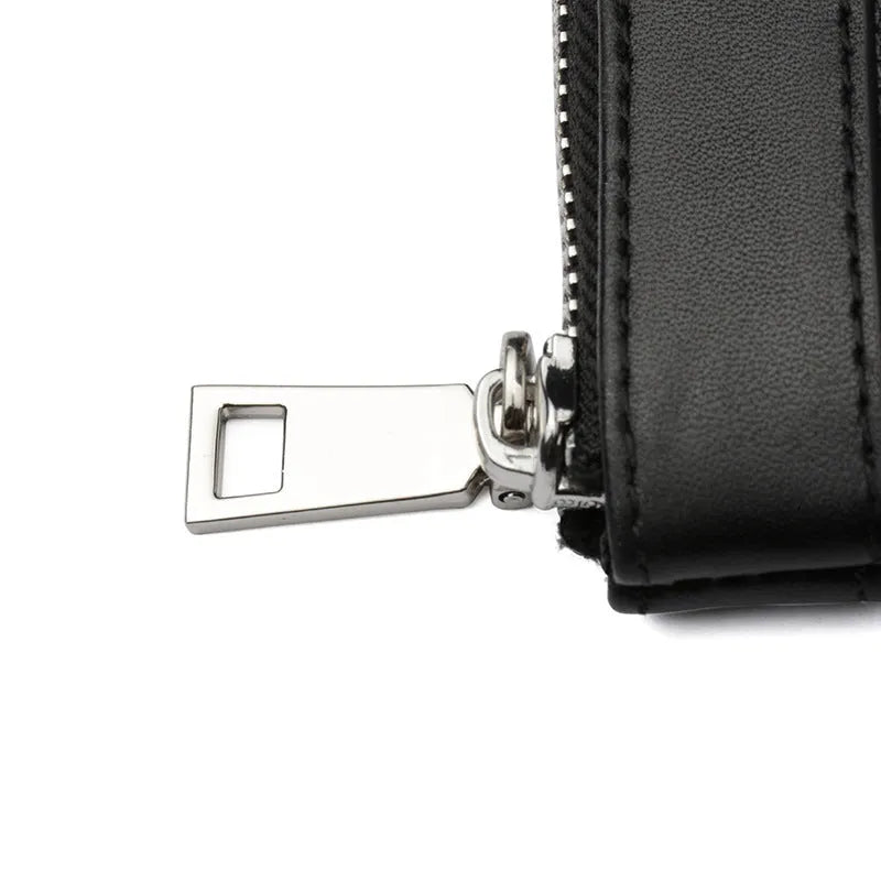 Black men's leather clutch wallet showing front view and open interior with polyester lining.