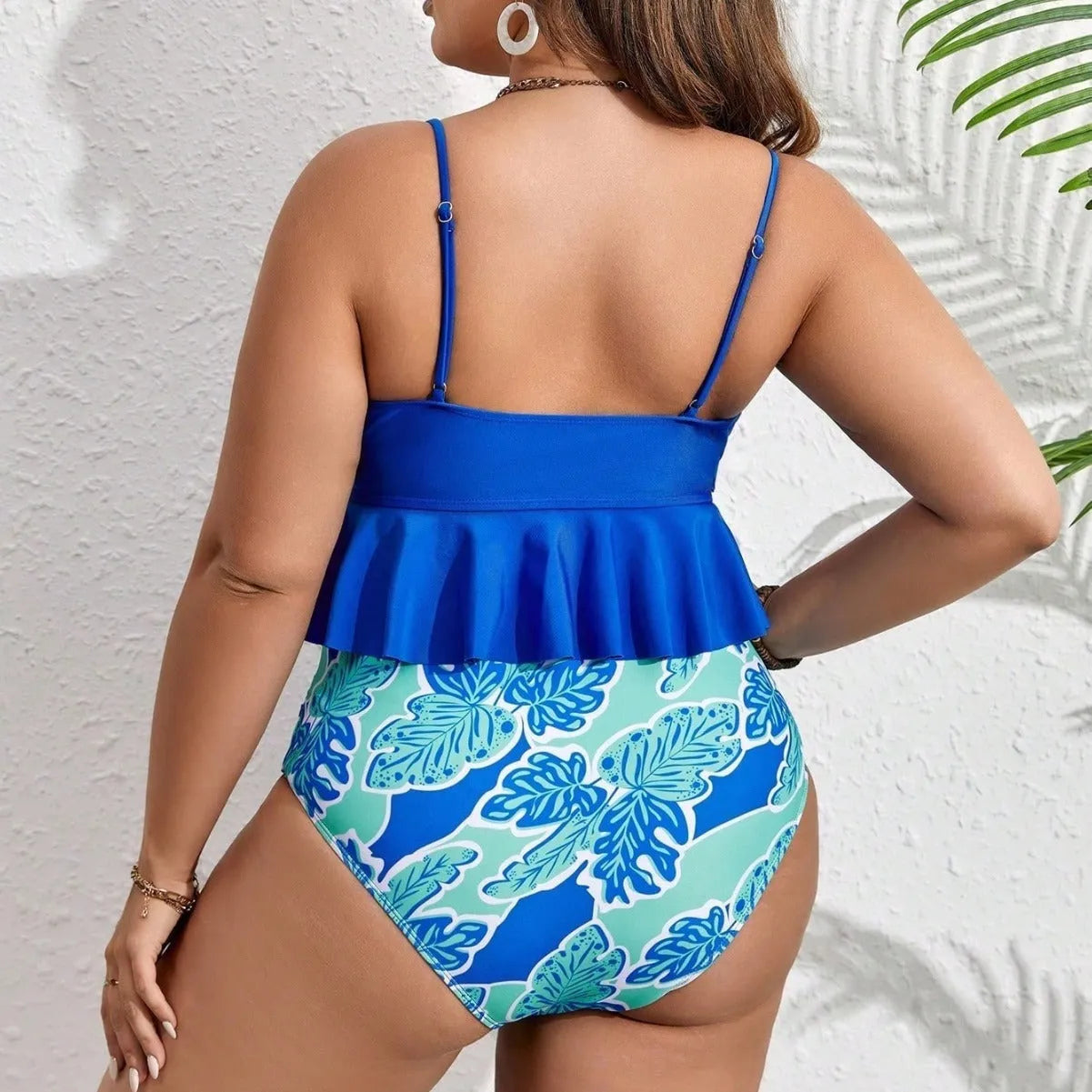 Blue plus-size polyester bikini swimsuit with separate top and shorts on a mannequin.