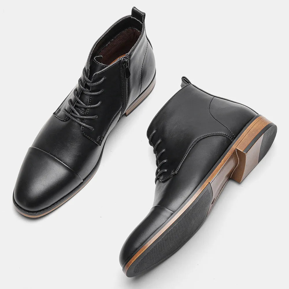 Men's brown Chelsea boot with a side zipper, round toe, and low wooden sole.