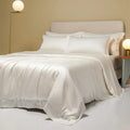 Lenzing Tencel quilt cover and pillowcase set in Aurora Blue, neatly arranged on a bed.
