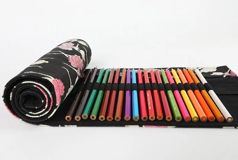 Canvas square rolling pencil case with ballet girl printing showing multiple colour pencils organised in slots