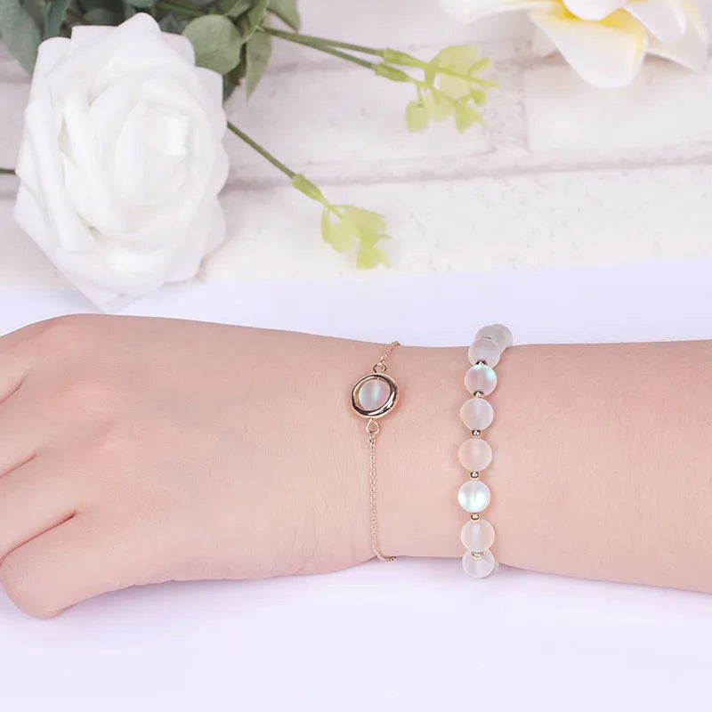 Double-layer women's bracelet with crystal beads and lucky charms in gold electroplated finish