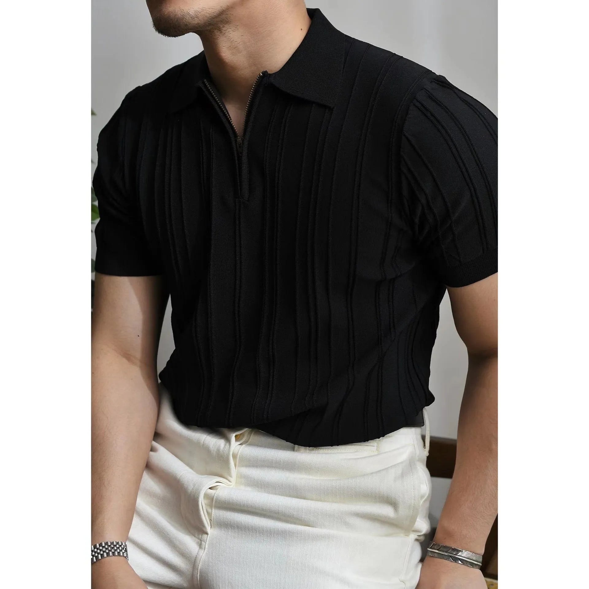 Men's loose-fit zipper short-sleeve knitted polo shirt in black, front view with lapel collar