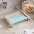 Solid wood cat bed with a removable fabric cover in a grey pink colour.