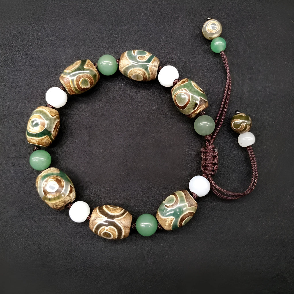 Green agate ethnic bracelet with three eye Tibet beads in hand-woven geometric pattern